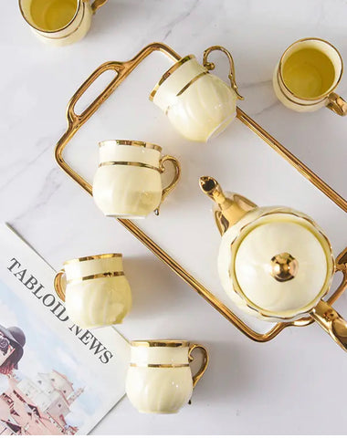 gold ceramic coffee cups and tray + teapot