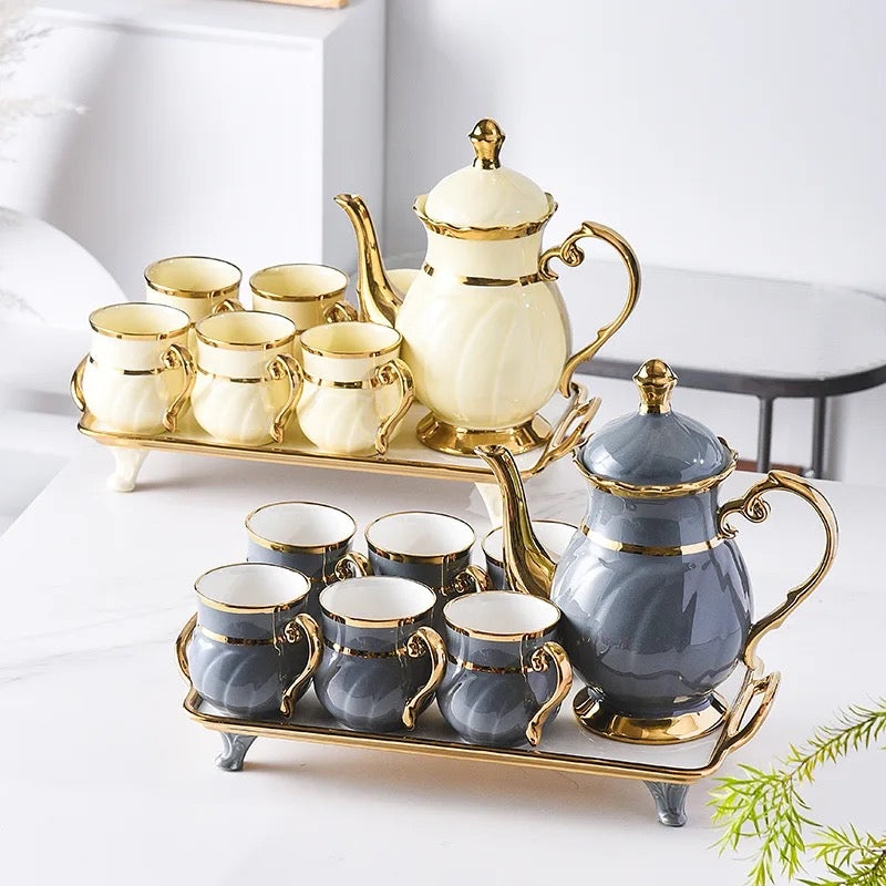 gold ceramic coffee cups and tray + teapot